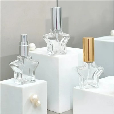 Garrafa de perfume em forma de estrela